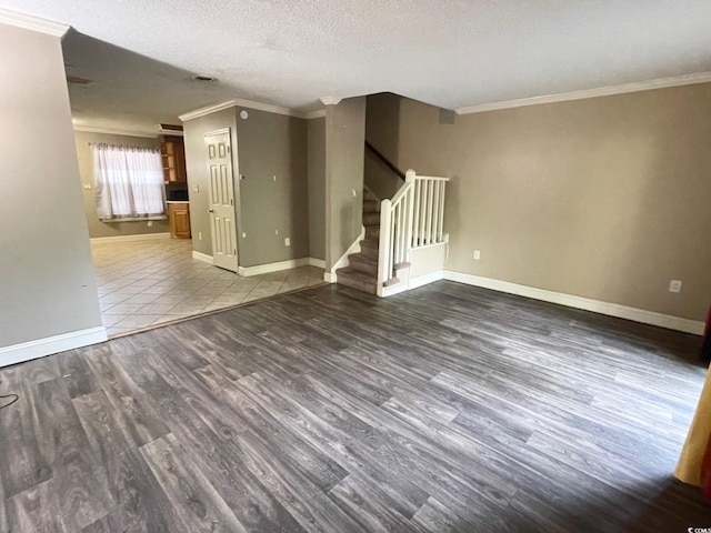 600 65th Ave N Unit 8, Myrtle Beach, SC 29572 - spare room with ornamental molding, stairway, wood finished floors, baseboards, and a textured ceiling