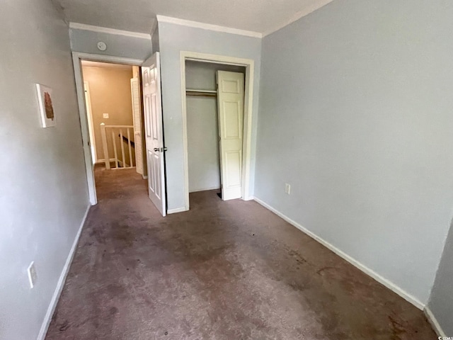 600 65th Ave N Unit 8, Myrtle Beach, SC 29572 - unfurnished bedroom featuring baseboards, ornamental molding, and a closet