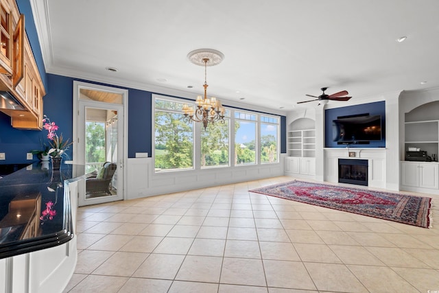 1080 Waterway Ln, Myrtle Beach, SC 29572 - living room with built in shelves, ceiling fan, light tile patterned floors, a chandelier, and a glass covered fireplace