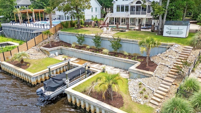 1080 Waterway Ln, Myrtle Beach, SC 29572 - rear view of house with a water view, a patio area, boat lift, and stairway