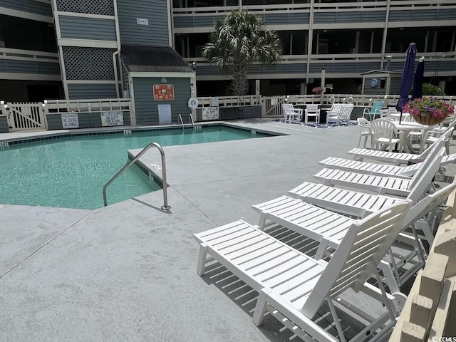 1101 Possum Trot Rd Unit A202, North Myrtle Beach, SC 29582 - community pool featuring a patio
