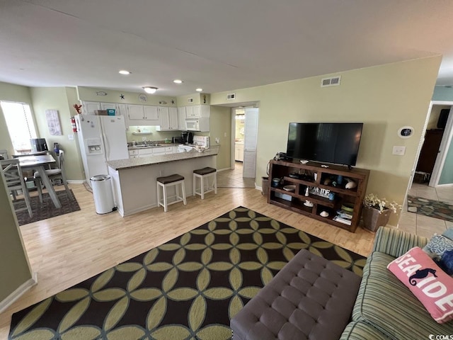 1101 Possum Trot Rd Unit A202, North Myrtle Beach, SC 29582 - living room with recessed lighting and light wood-style flooring