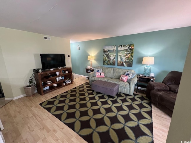 1101 Possum Trot Rd Unit A202, North Myrtle Beach, SC 29582 - living room with wood finished floors and baseboards