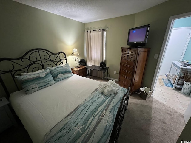 1101 Possum Trot Rd Unit A202, North Myrtle Beach, SC 29582 - carpeted bedroom with a textured ceiling