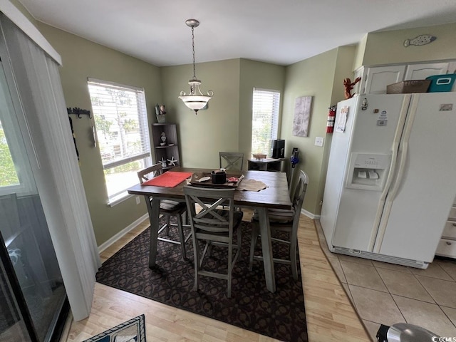 1101 Possum Trot Rd Unit A202, North Myrtle Beach, SC 29582 - dining area featuring light wood-style flooring and baseboards