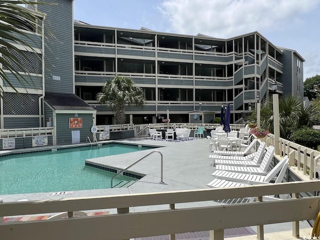 1101 Possum Trot Rd Unit A202, North Myrtle Beach, SC 29582 - community pool with a patio