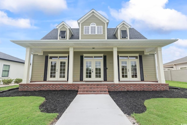 853 Bluffview Dr, Myrtle Beach, SC 29579 - view of front of property featuring french doors, covered porch, and a shingled roof