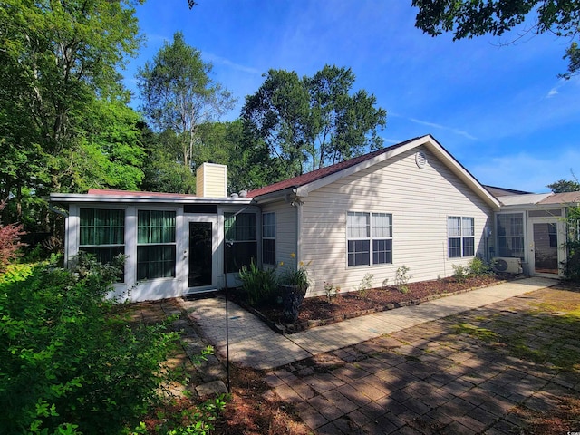 3904 Williamson Cir, Myrtle Beach, SC 29579 - back of house featuring a chimney and a patio