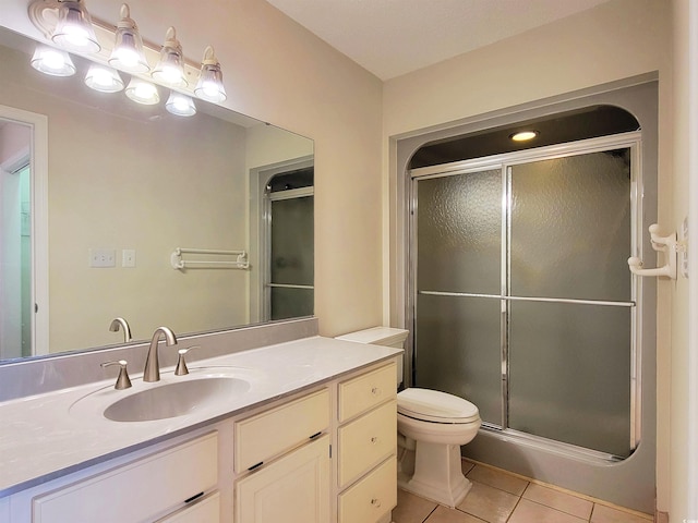 3904 Williamson Cir, Myrtle Beach, SC 29579 - bathroom featuring tile patterned flooring, a stall shower, vanity, and toilet