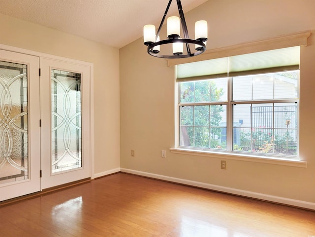 3904 Williamson Cir, Myrtle Beach, SC 29579 - spare room with a chandelier, wood finished floors, and baseboards