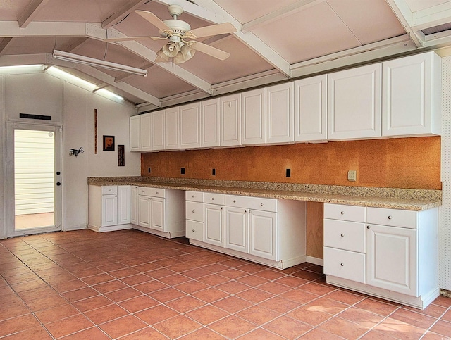 3904 Williamson Cir, Myrtle Beach, SC 29579 - kitchen featuring white cabinets, ceiling fan, light tile patterned floors, and baseboards