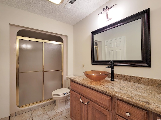 3904 Williamson Cir, Myrtle Beach, SC 29579 - full bathroom with vanity, a stall shower, toilet, tile patterned floors, and a textured ceiling