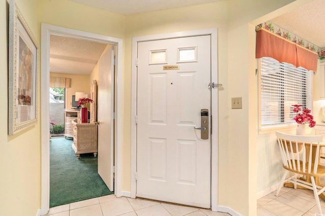 213 Westleton Dr Unit 16B, Myrtle Beach, SC 29572 - foyer with light tile patterned floors and a textured ceiling