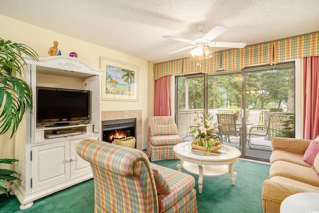 213 Westleton Dr Unit 16B, Myrtle Beach, SC 29572 - carpeted living area featuring ceiling fan, a textured ceiling, a tiled fireplace, and wallpapered walls