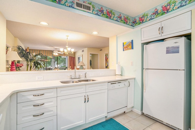 213 Westleton Dr Unit 16B, Myrtle Beach, SC 29572 - kitchen featuring white appliances, a chandelier, white cabinets, light tile patterned floors, and light countertops