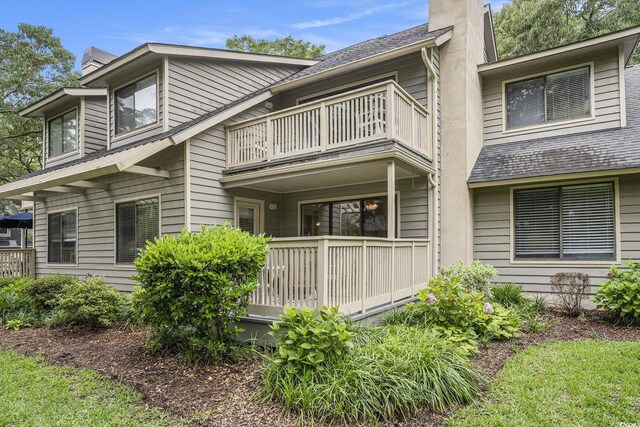 213 Westleton Dr Unit 16B, Myrtle Beach, SC 29572 - view of front of house with a balcony and a chimney