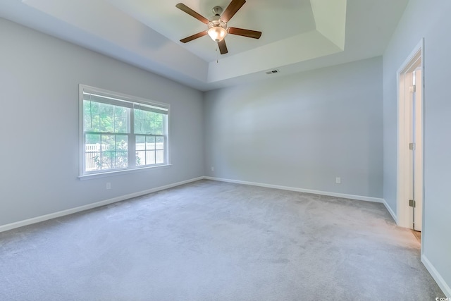 617 Chiswick Dr, Conway, SC 29526 - carpeted empty room featuring ceiling fan, a tray ceiling, and baseboards