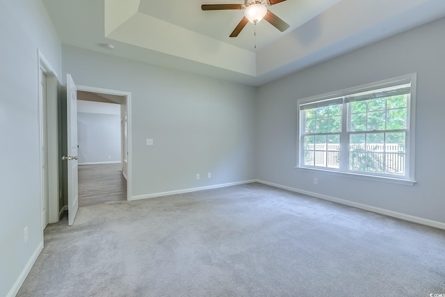 617 Chiswick Dr, Conway, SC 29526 - spare room with a raised ceiling, ceiling fan, carpet floors, and baseboards