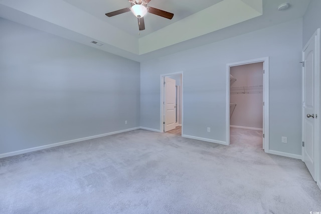 617 Chiswick Dr, Conway, SC 29526 - unfurnished bedroom featuring a spacious closet, carpet, baseboards, a tray ceiling, and a closet