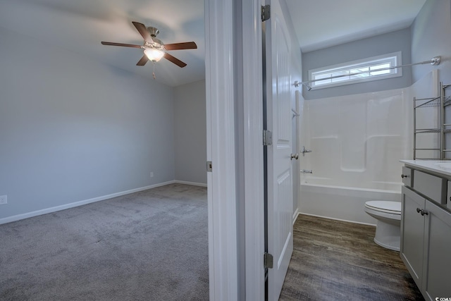617 Chiswick Dr, Conway, SC 29526 - bathroom with toilet, vanity, a ceiling fan, shower / bath combination, and baseboards
