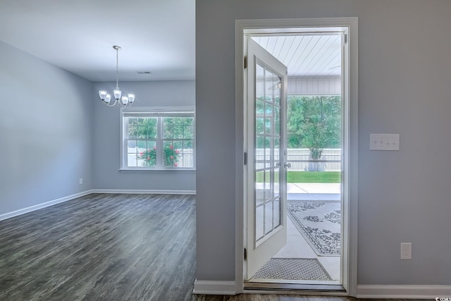 617 Chiswick Dr, Conway, SC 29526 - doorway to outside with a chandelier, dark wood-style floors, and baseboards