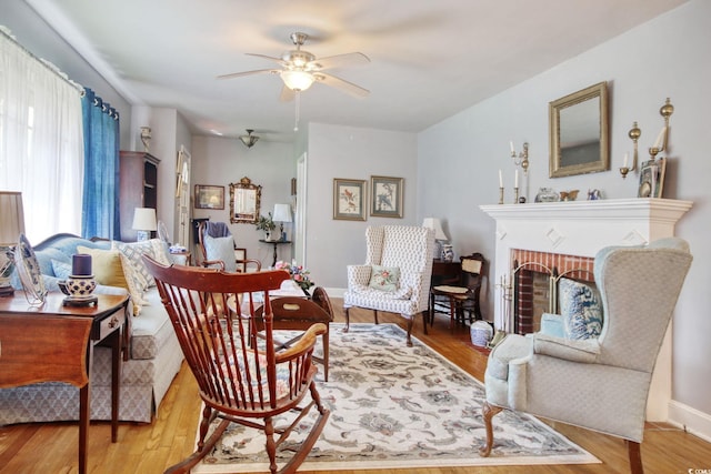 2004 Seitter St, Georgetown, SC 29440 - living area featuring ceiling fan, wood finished floors, and a brick fireplace