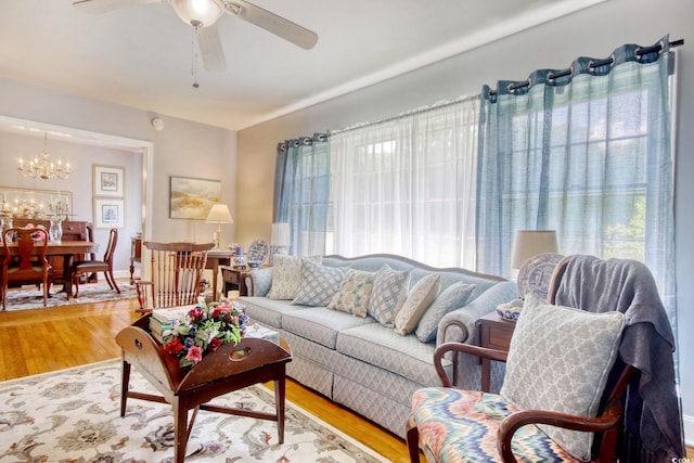 2004 Seitter St, Georgetown, SC 29440 - living area featuring healthy amount of natural light, a chandelier, ceiling fan, and wood finished floors