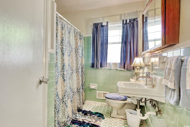 2004 Seitter St, Georgetown, SC 29440 - full bathroom with a shower with curtain, tile walls, and tile patterned floors