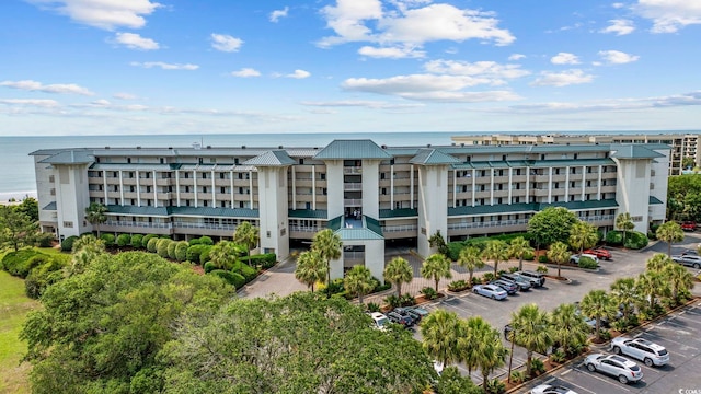 601 Retreat Beach Cir Unit 213, Pawleys Island, SC 29585 - view of apartment building / complex with uncovered parking and a water view