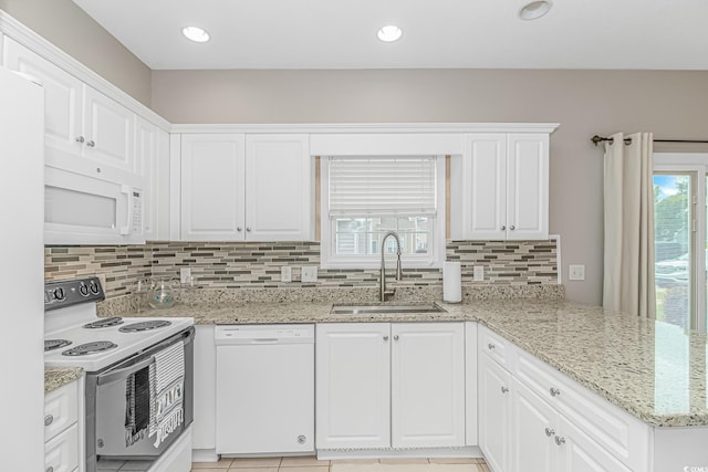 503 20th Ave N Unit 15B, North Myrtle Beach, SC 29582 - kitchen with white appliances, a sink, tasteful backsplash, white cabinetry, and recessed lighting
