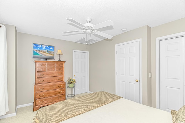 503 20th Ave N Unit 15B, North Myrtle Beach, SC 29582 - bedroom with baseboards, light carpet, ceiling fan, and a closet