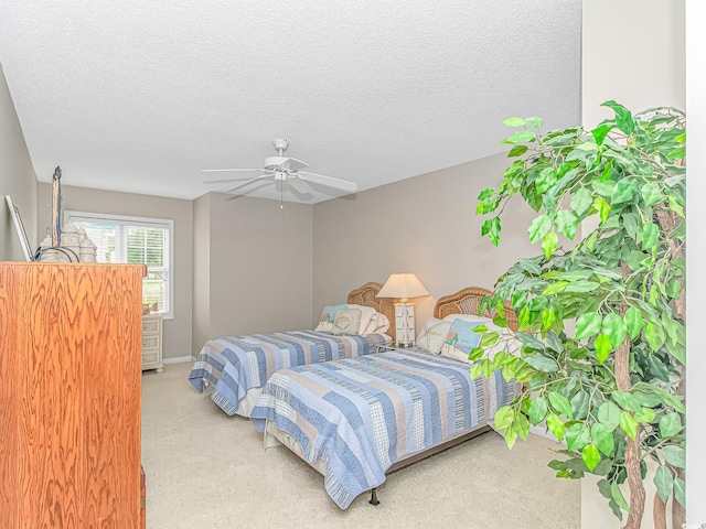503 20th Ave N Unit 15B, North Myrtle Beach, SC 29582 - bedroom with carpet, a textured ceiling, and ceiling fan