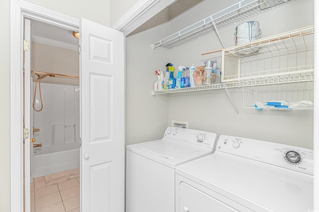 503 20th Ave N Unit 15B, North Myrtle Beach, SC 29582 - laundry area with washer and dryer and light tile patterned floors