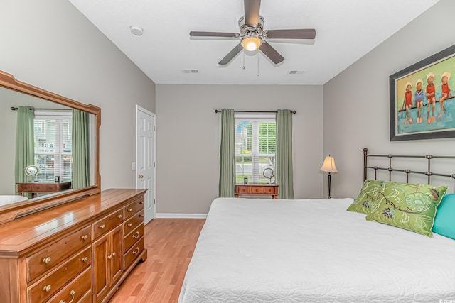503 20th Ave N Unit 15B, North Myrtle Beach, SC 29582 - bedroom featuring light wood-style floors, ceiling fan, and baseboards