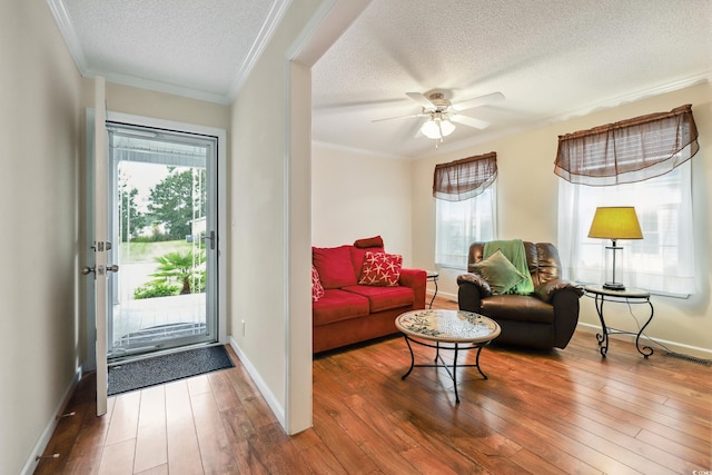 263 Walden Lake Rd, Conway, SC 29526 - living room with a textured ceiling, healthy amount of natural light, wood-type flooring, ornamental molding, and baseboards