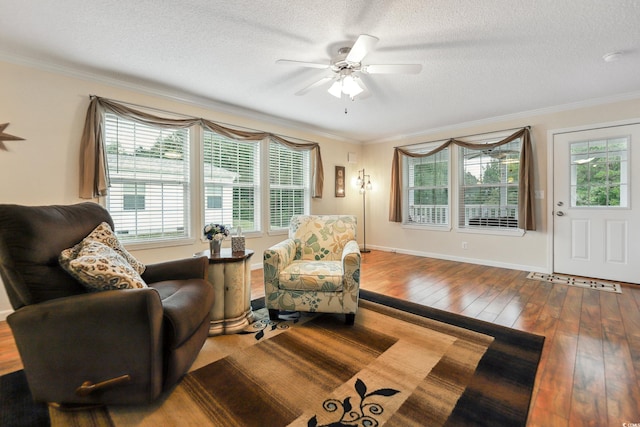 263 Walden Lake Rd, Conway, SC 29526 - sitting room with crown molding, a textured ceiling, hardwood / wood-style floors, a ceiling fan, and baseboards