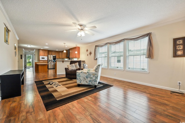 263 Walden Lake Rd, Conway, SC 29526 - living area featuring ceiling fan, ornamental molding, a textured ceiling, plenty of natural light, and baseboards