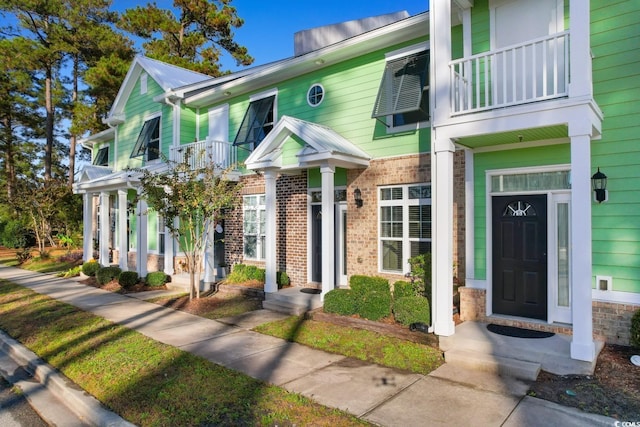 788 Gabreski Ln Unit B4, Myrtle Beach, SC 29577 - view of property featuring a balcony and brick siding