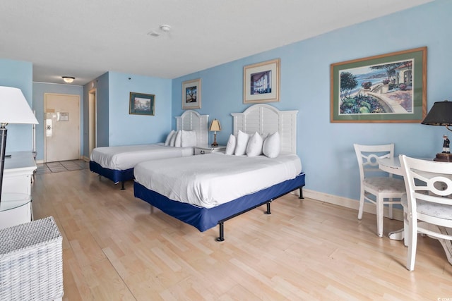 1207 S Ocean Blvd Unit 51312, Myrtle Beach, SC 29577 - bedroom with light wood-style floors and baseboards
