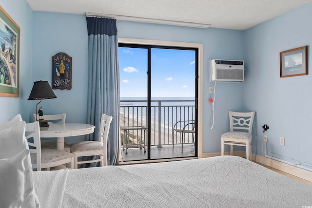 1207 S Ocean Blvd Unit 51312, Myrtle Beach, SC 29577 - bedroom featuring a water view, a wall mounted air conditioner, and access to exterior