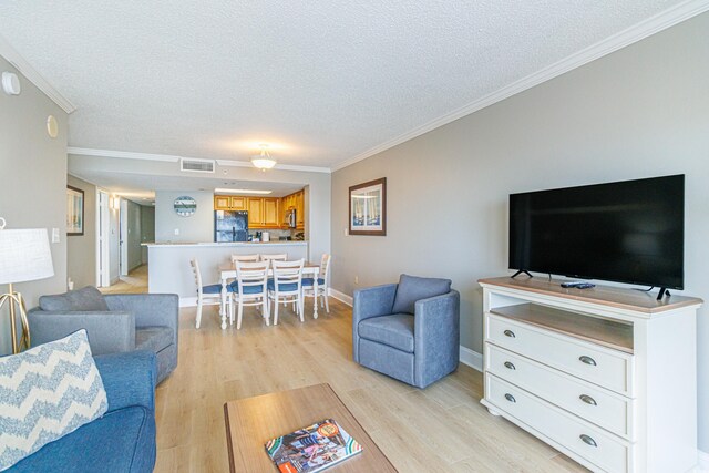 7100 N Ocean Blvd Unit 1421, Myrtle Beach, SC 29572 - living area with a textured ceiling, crown molding, and light wood finished floors