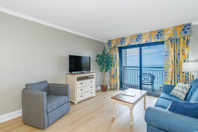 7100 N Ocean Blvd Unit 1421, Myrtle Beach, SC 29572 - living room featuring crown molding, baseboards, light wood-style floors, and a textured ceiling