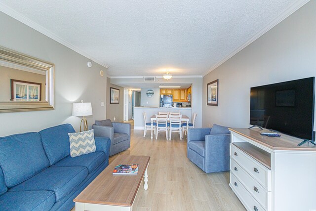 7100 N Ocean Blvd Unit 1421, Myrtle Beach, SC 29572 - living area featuring light wood finished floors, a textured ceiling, and crown molding