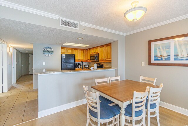 7100 N Ocean Blvd Unit 1421, Myrtle Beach, SC 29572 - dining room featuring a textured ceiling, light wood-style floors, ornamental molding, and baseboards