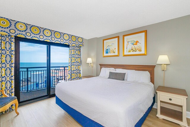 7100 N Ocean Blvd Unit 1421, Myrtle Beach, SC 29572 - bedroom with wood finished floors, access to outside, baseboards, and a water view