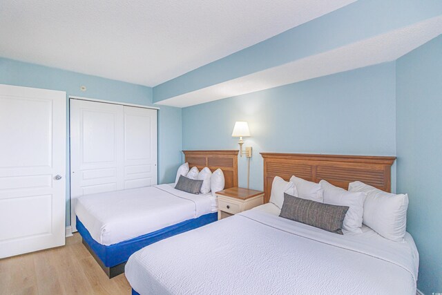 7100 N Ocean Blvd Unit 1421, Myrtle Beach, SC 29572 - bedroom with light wood-style flooring and a closet