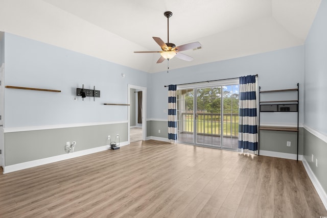 4767 Wild Iris Dr Unit 203, Myrtle Beach, SC 29579 - unfurnished living room featuring ceiling fan, wood finished floors, baseboards, and high vaulted ceiling