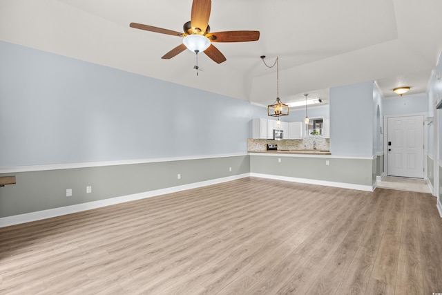 4767 Wild Iris Dr Unit 203, Myrtle Beach, SC 29579 - unfurnished living room with light wood-style flooring, a ceiling fan, and baseboards