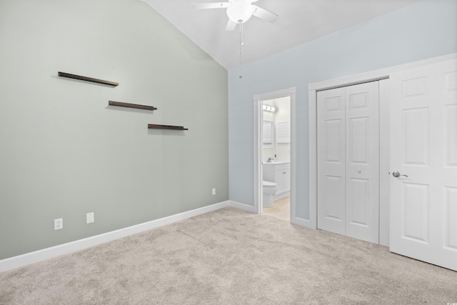 4767 Wild Iris Dr Unit 203, Myrtle Beach, SC 29579 - unfurnished bedroom with carpet flooring, lofted ceiling, connected bathroom, baseboards, and a closet