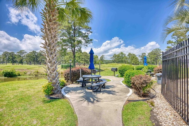 4767 Wild Iris Dr Unit 203, Myrtle Beach, SC 29579 - view of patio featuring view of wooded area